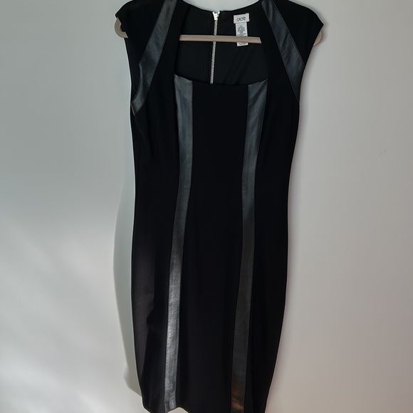 New Cache black stylish below the knee dress. Leather accents,zipper down back. - Picture 2 of 7